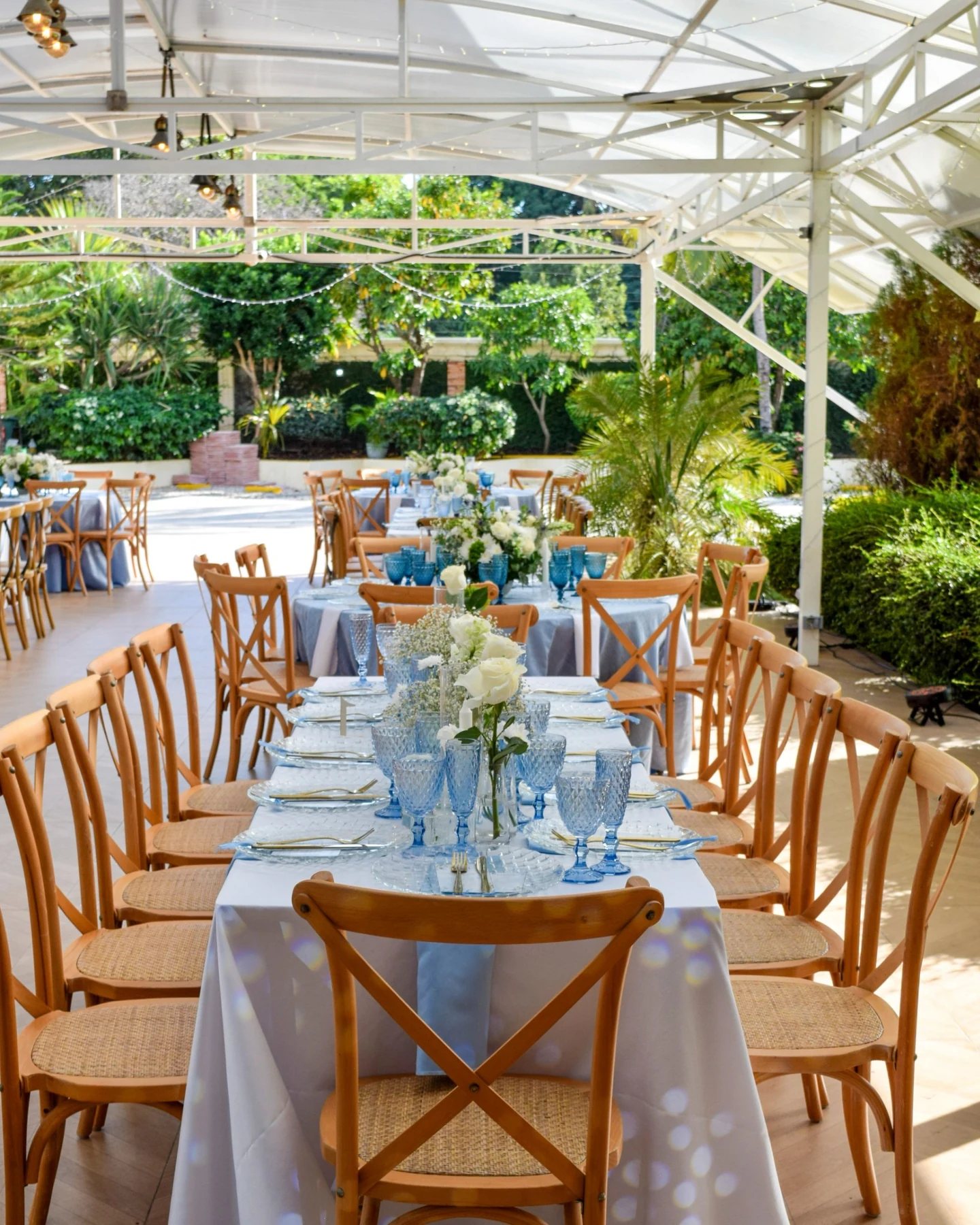 Elegant wedding reception tables in a bright venue